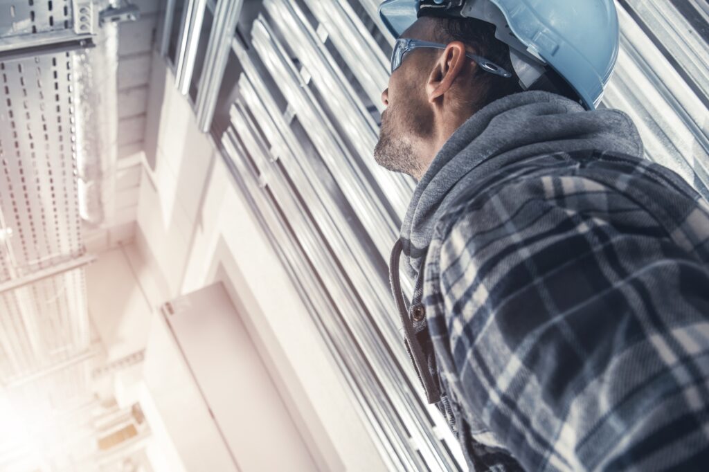 Construction Supervisor Contractor Looking on an Installed Electrical Lines